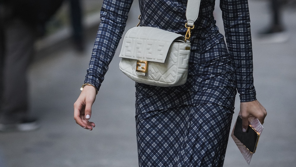 16 Best Designer Bags That Are Always On Trend According to Bagover Editors 4 fendi baguette bag in white with thick strap and gold hardware