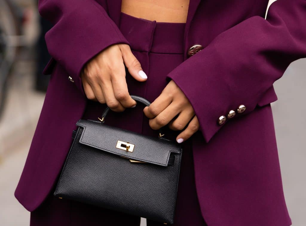 hermes mini kelly bag in black with purple blazer