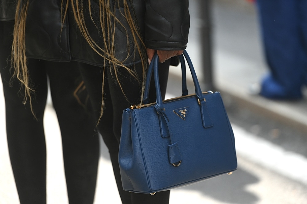16 Best Designer Bags That Are Always On Trend According to Bagover Editors 10 prada galleria bag in dark blue and gold hardware in navy