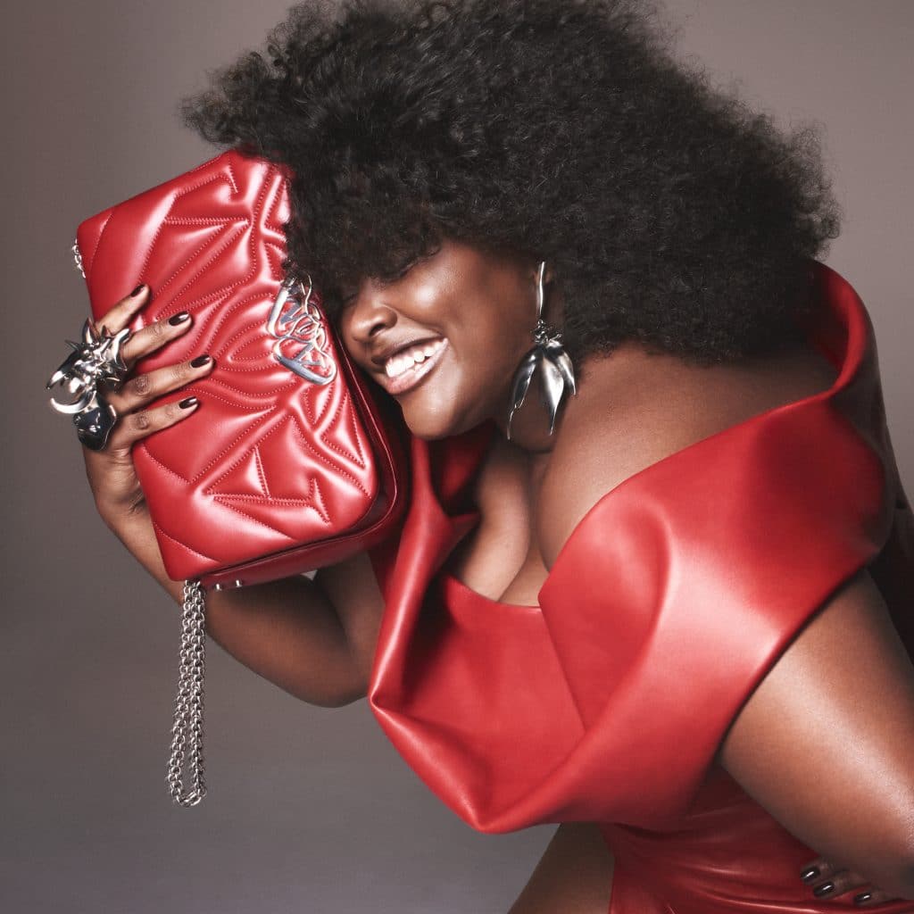 Alexander McQueen Seal Bag: The Brand's Bag of the Season 7 alexander mcqueen seal bag in red model wearing red